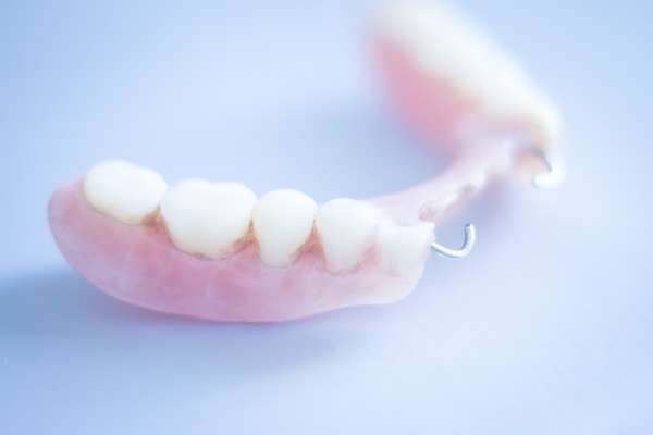 Should I Get Dentures or Dental Implants from Highlands Family Dentistry in Dallas, TX